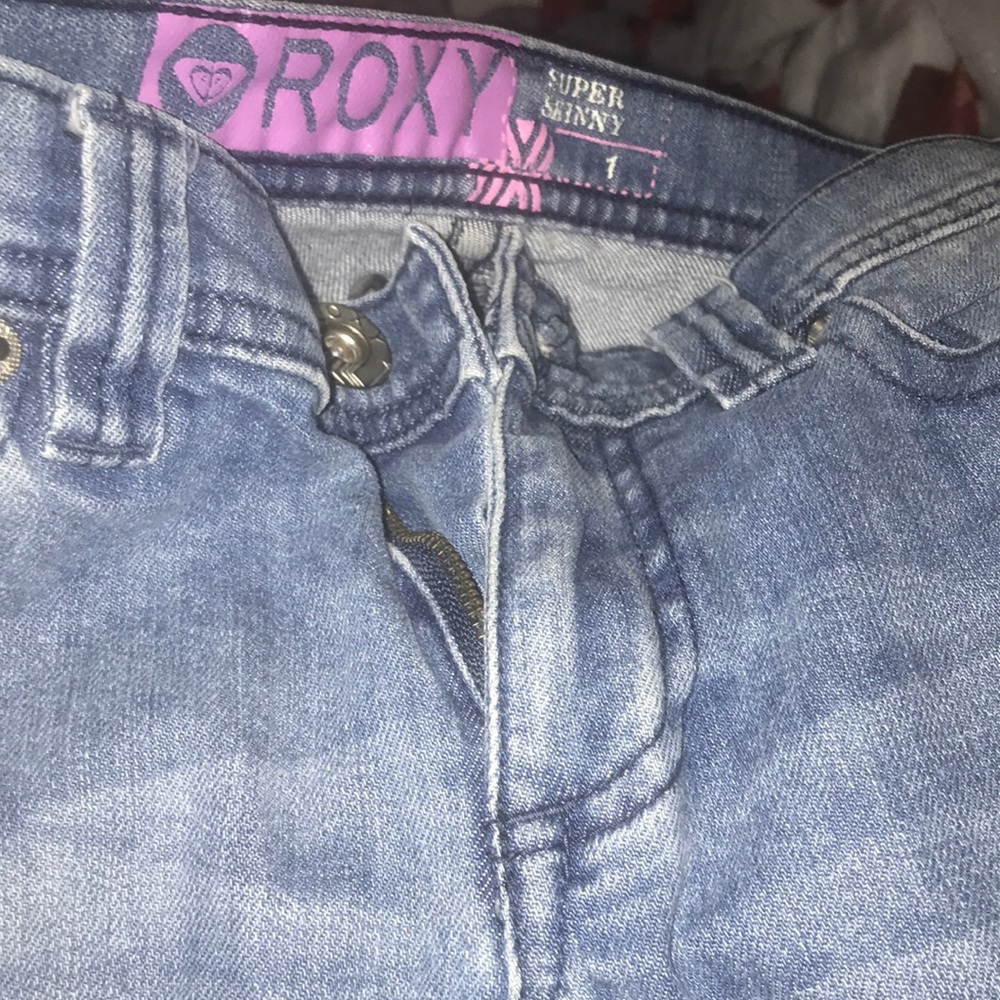 Women’s mid rise ripped jeans
